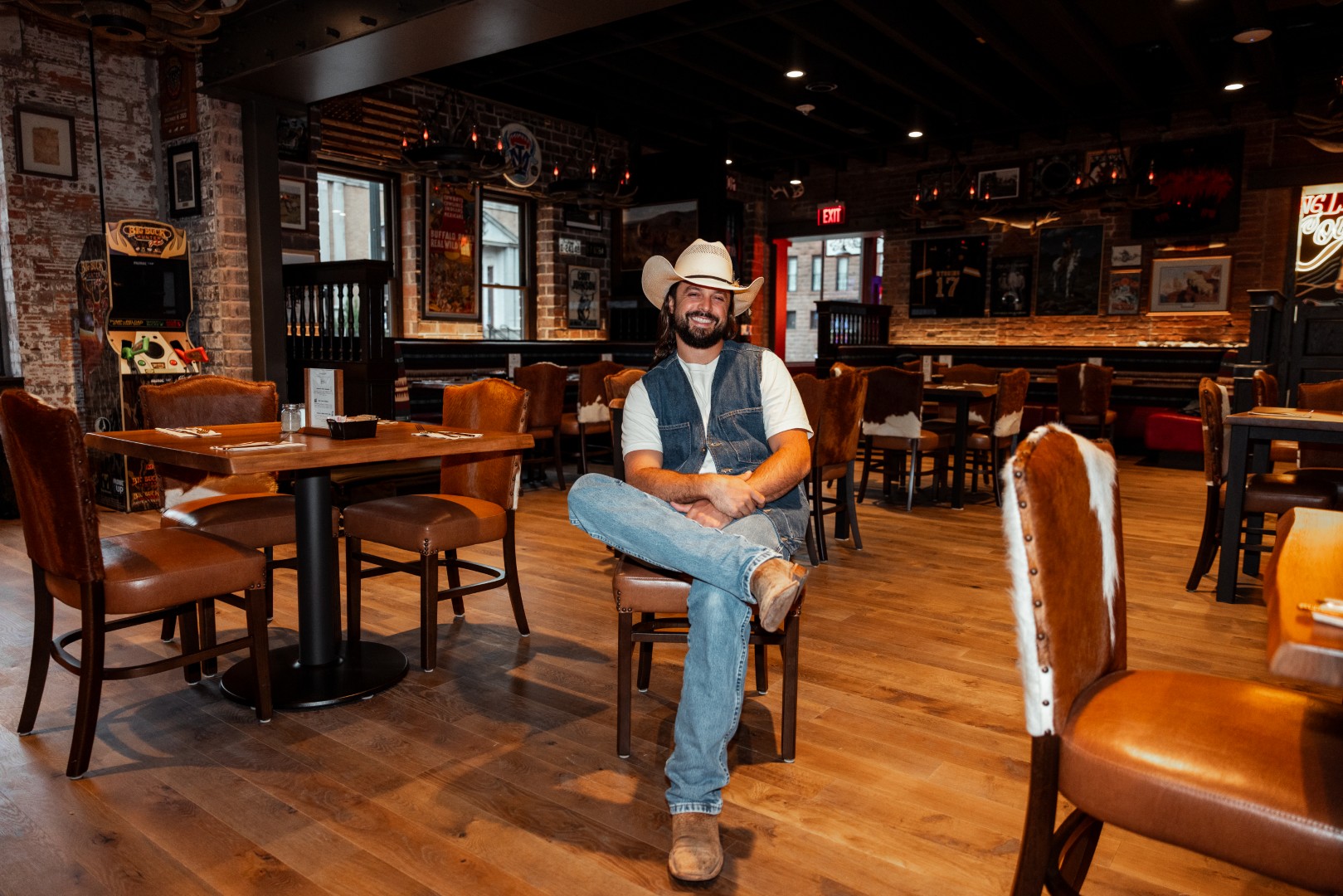 Ian Munsick seated inside the Cowboy Bar