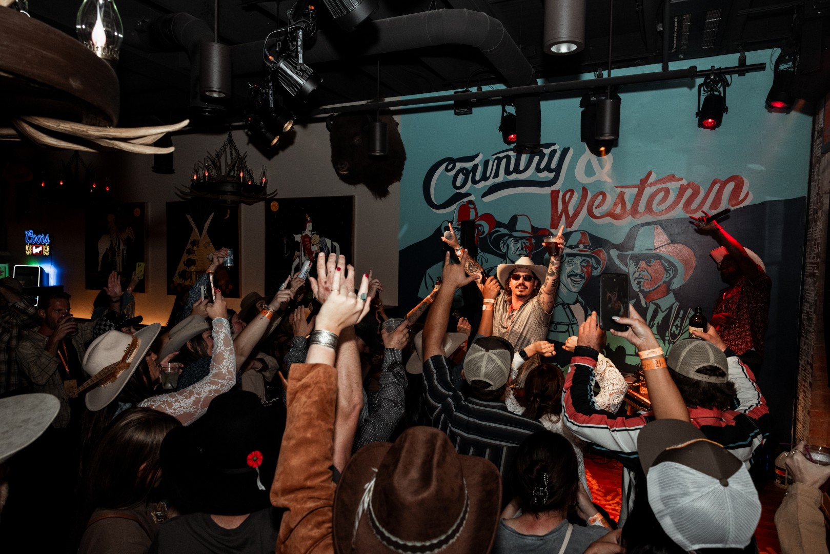 Crowd cheering in front of the Country & Western stage